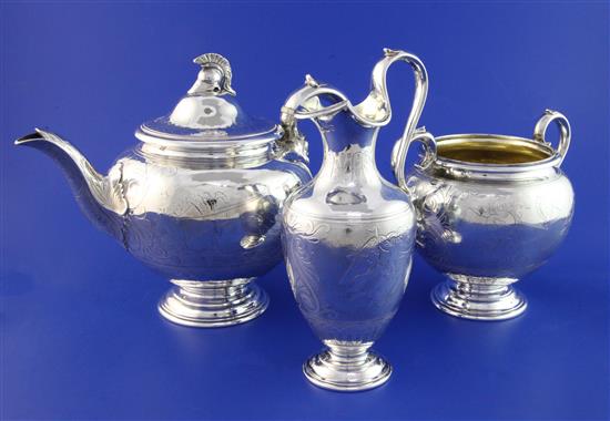 A Victorian silver three piece tea set by Edward & John Barnard, gross 43.5 oz.